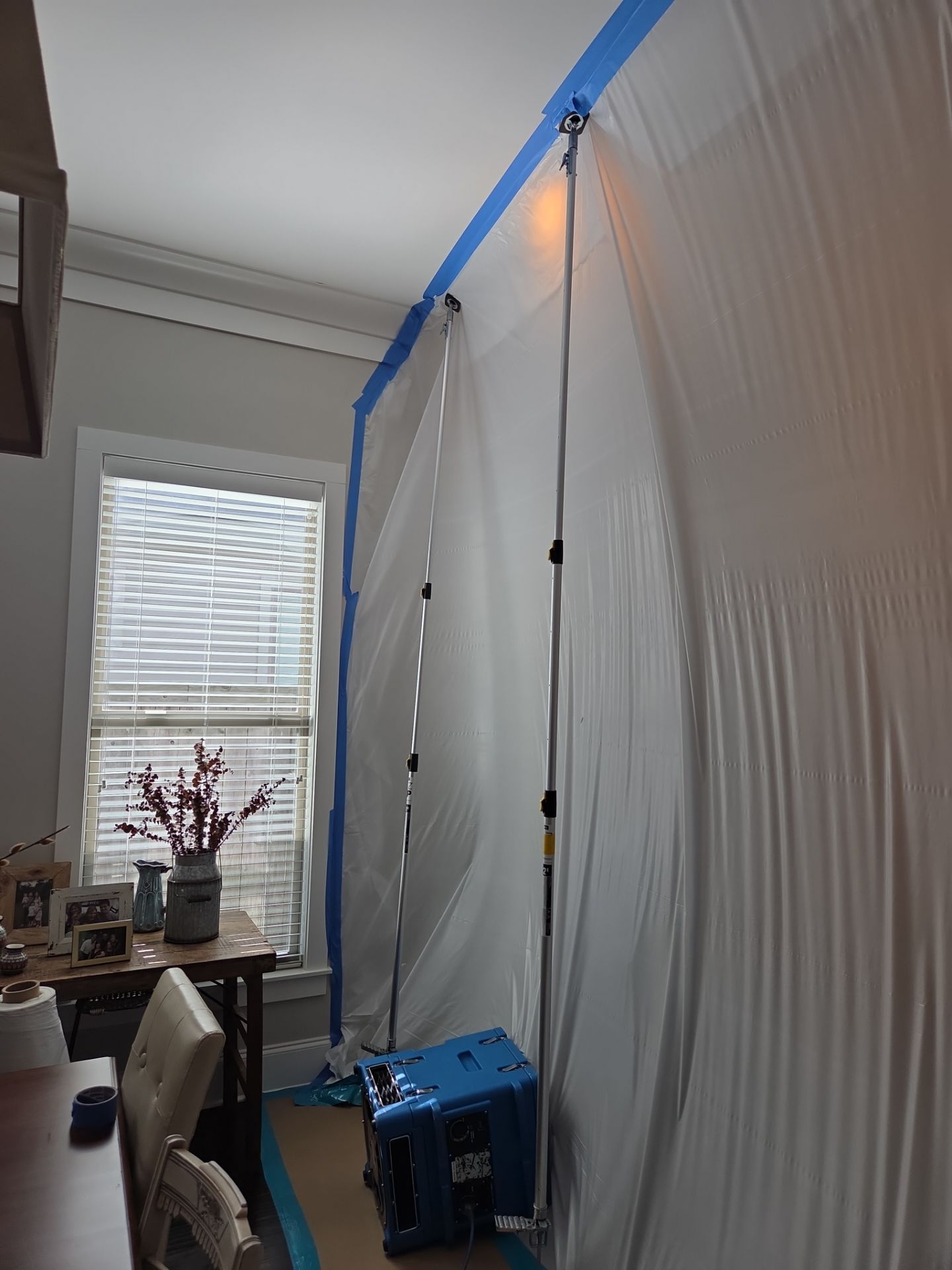 Negative air containment setup for mold remediation in kitchen area